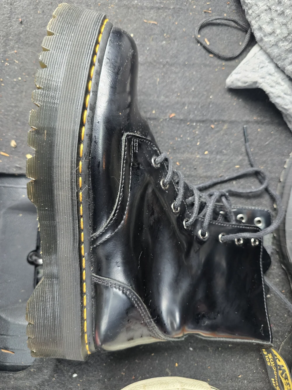 Dr. Martens Black Patent Lace-Up Combat Boots with Yellow Welt Stitching